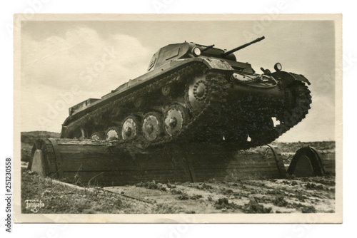 Old German postcard-black and white photo: "Our Wehrmacht" series: PzKpfw II tank overcomes an obstacle at the training ground. world war II, Germany, third Reich