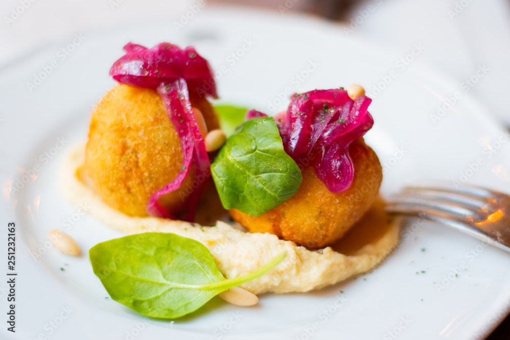 Fried Croquettes On A Place On A Table In an Italian Restaurant In Rome, Italy. Fried Croquettes On A Place On A Table In an Italian Restaurant In Rome, Italy.