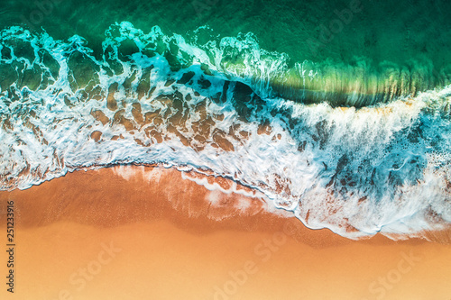 Fototapeta Naklejka Na Ścianę i Meble -  Aerial view of sea waves and sandy beach