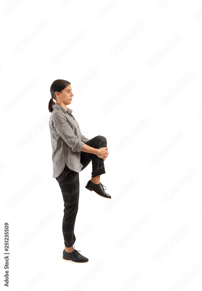 Young businesswoman isolated on white background doing exercises Young businesswoman isolated on white background doing exercises