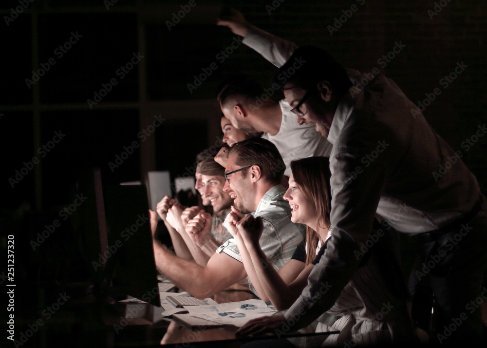 young business team analyzing computer data young business team analyzing computer data