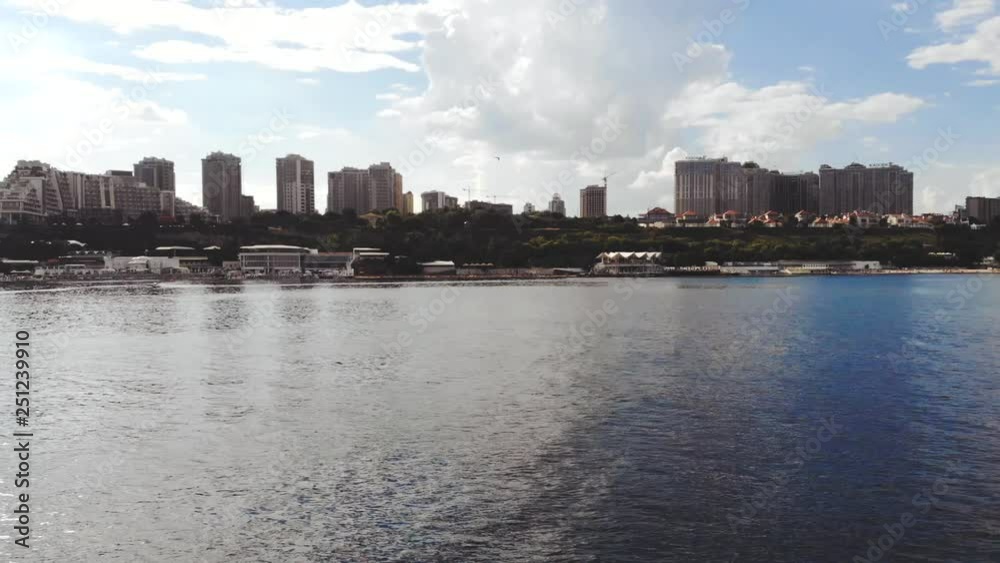 Water bike with a bird's-eye view of the city on the horizon. Urban buildings aerial on the city skyline, aerial view.