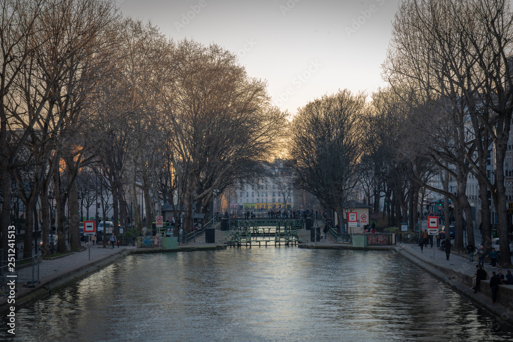 Fototapeta premium Paris, France - 02 23 2019: View of the Canal Saint-Martin at sunset