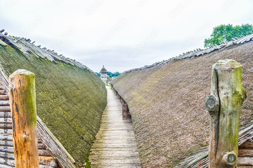 Fototapeta premium Corridor between the two main wooden huts of the Biskupin ancient village, Poland