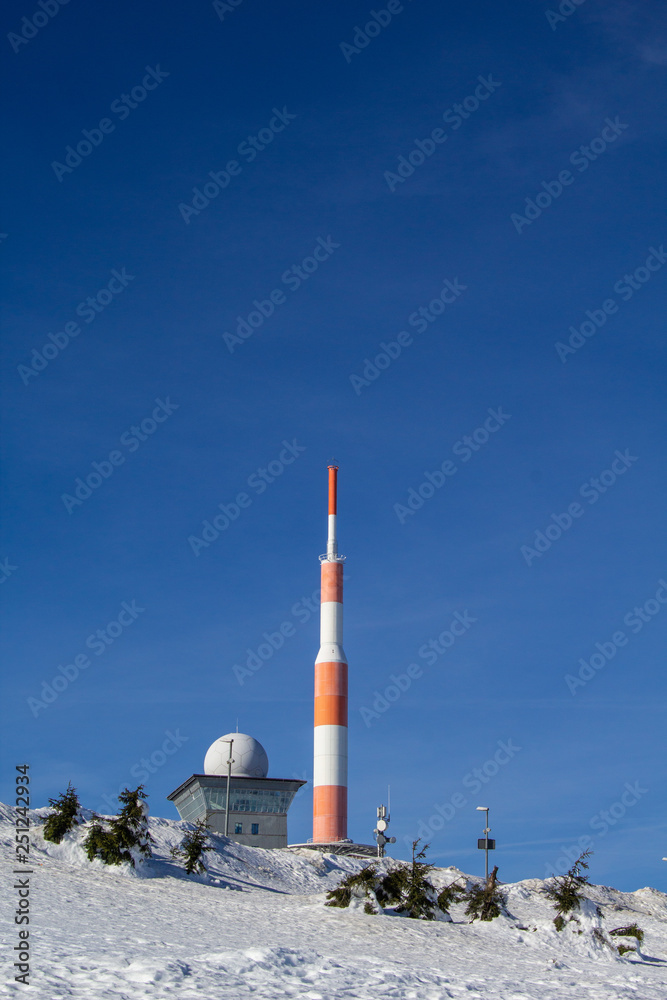 top of Brocken mountain, snow covered winter landscape on highest mountain in Saxony Anhalt, Germany