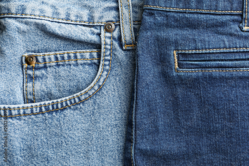 Closeup view of jeans pocket as background, space for text Closeup view of jeans pocket as background, space for text