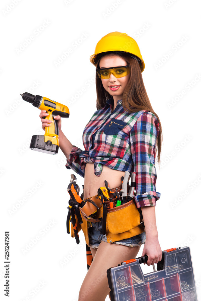 beautiful girl builder with a tool on the belt on a white background beautiful girl builder with a tool on the belt on a white background