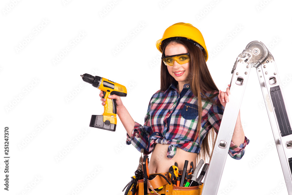 beautiful girl builder with a tool on the belt on a white background beautiful girl builder with a tool on the belt on a white background