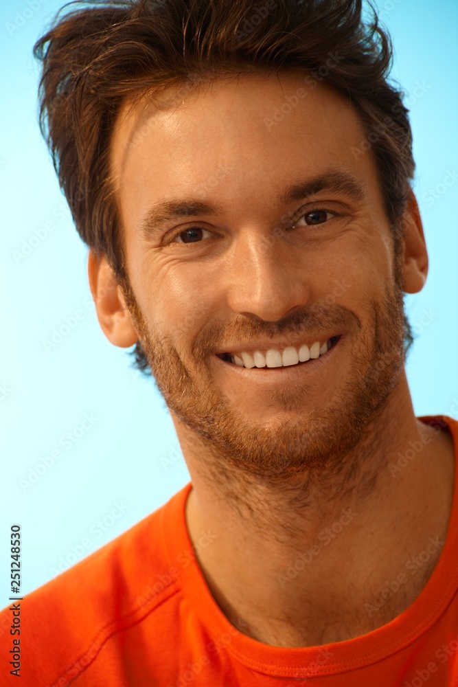 Obraz premium Portrait of happy handsome casual man