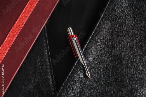 red parker pen in jacket