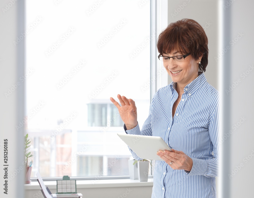 Senior casual businesswoman with tablet computer Senior casual businesswoman with tablet computer