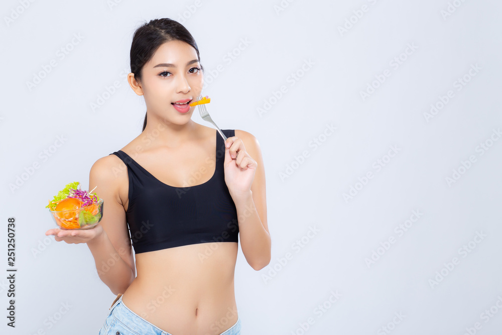 Beautiful portrait young asian woman smiling holding salad vegetable food isolated on white background, girl diet eating vegetarian for healthy, health care or wellness concept. Beautiful portrait young asian woman smiling holding salad vegetable food isolated on white background, girl diet eating vegetarian for healthy, health care or wellness concept.