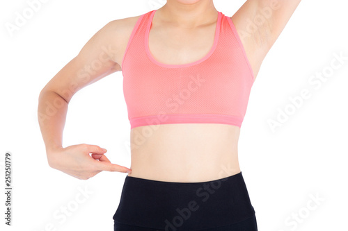Closeup beautiful asian woman in sport clothing pointing waist with satisfied and confident isolated on white background, girl asia have shape and wellness, exercise for fit with health concept.