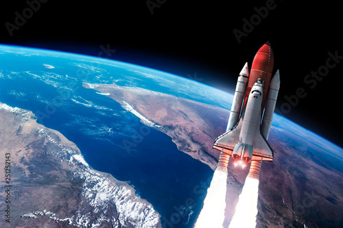 Fototapeta Naklejka Na Ścianę i Meble -  Space shuttle launch in the open space over the Earth. Blue gradient. Space art wallpaper. Elements of this image furnished by NASA