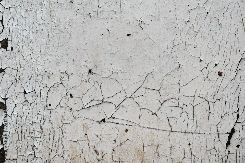 Fototapeta premium Texture of cracked paint on a wall, black and white grunge urban background, distressed overlay