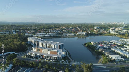 Forward flight towards luxury real estate at Varsity Lakes, Gold Coast, Australia