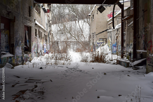 Canvas Print abandoned and derelict factory ruins in winter