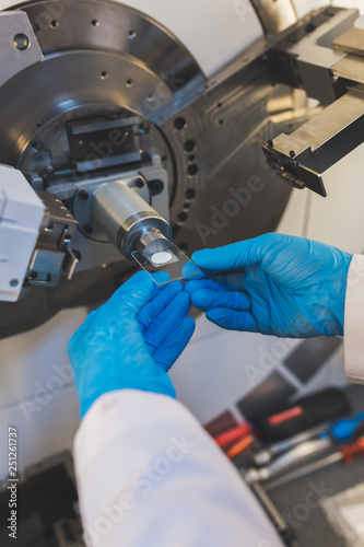 Картината върху платно Researcher, scientist, physicist or laboratory assistant working, experimenting and analyzing in modern lab with equipments, tools and machines