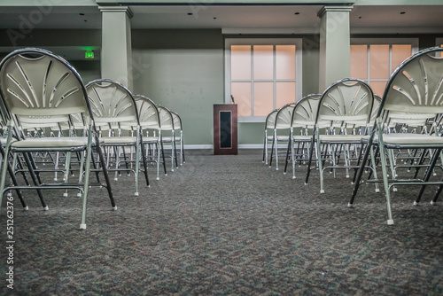 Podium and chairs in modern conference hall