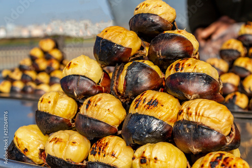 Photography Turkish street food, roasting chestnut grill. Close up