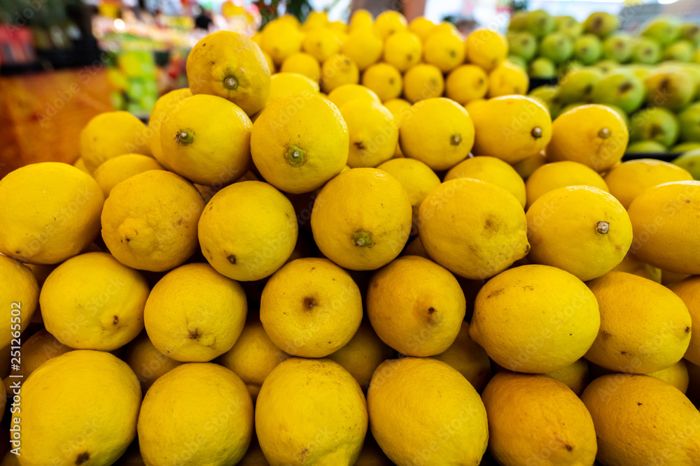 Fresh yellow organic lemons on a local food market, Bali island. Indonesia.