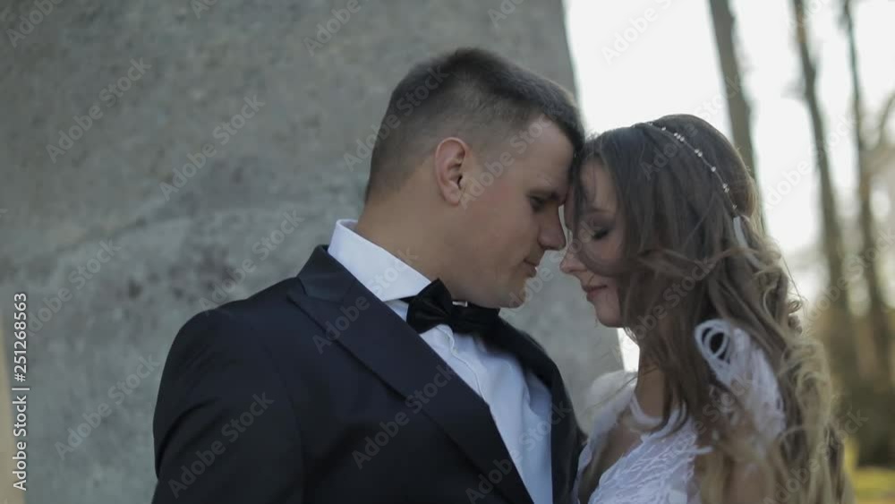 Wedding couple. Lovely groom and bride. Happy family. Man and woman in love. Wedding day. Slow motion Wedding couple. Lovely groom and bride. Happy family. Man and woman in love. Wedding day. Slow motion