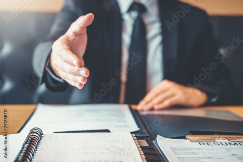 Shaking hands Business people greeting new colleagues while job interviewing shaking hands meeting Planning after during job interview Concept photo