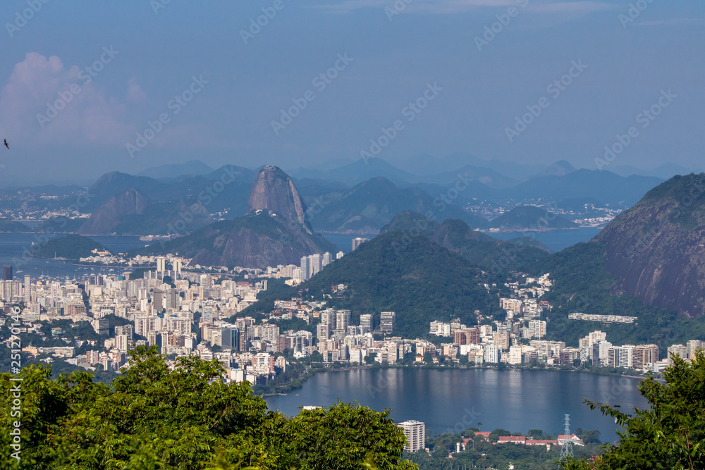Beautiful landscape with rainforest, city district (Leblon, Ipanema, Botafogo), Lagoon Rodrigo de Freitas and mountains (corcovado, sugarloaf, two brothers ) seen from Vista Chinesa in Tijuca Forest, 