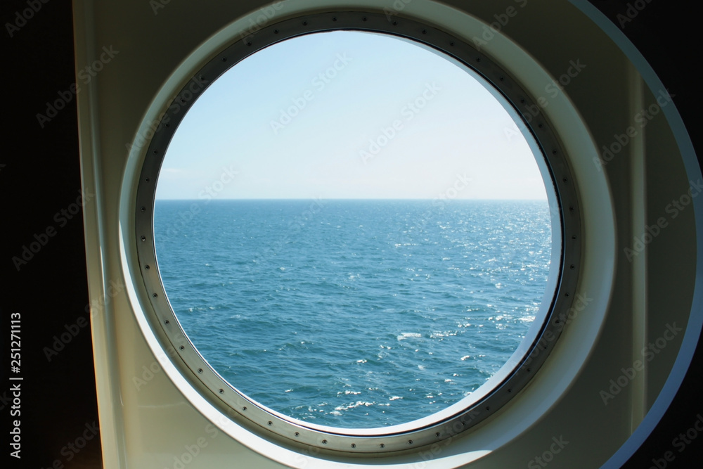 A view from the porthole window of a cruise ship