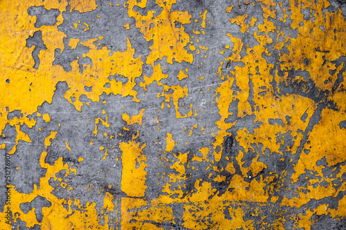 Grunge concrete wall yellow color for texture background © jakkapan