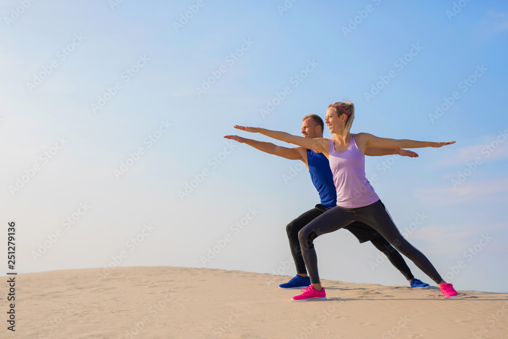 Couple stretching outdoors together Couple stretching outdoors together
