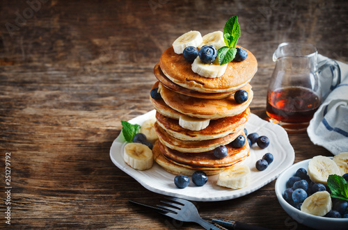 Pancakes with berries and honey, copy space