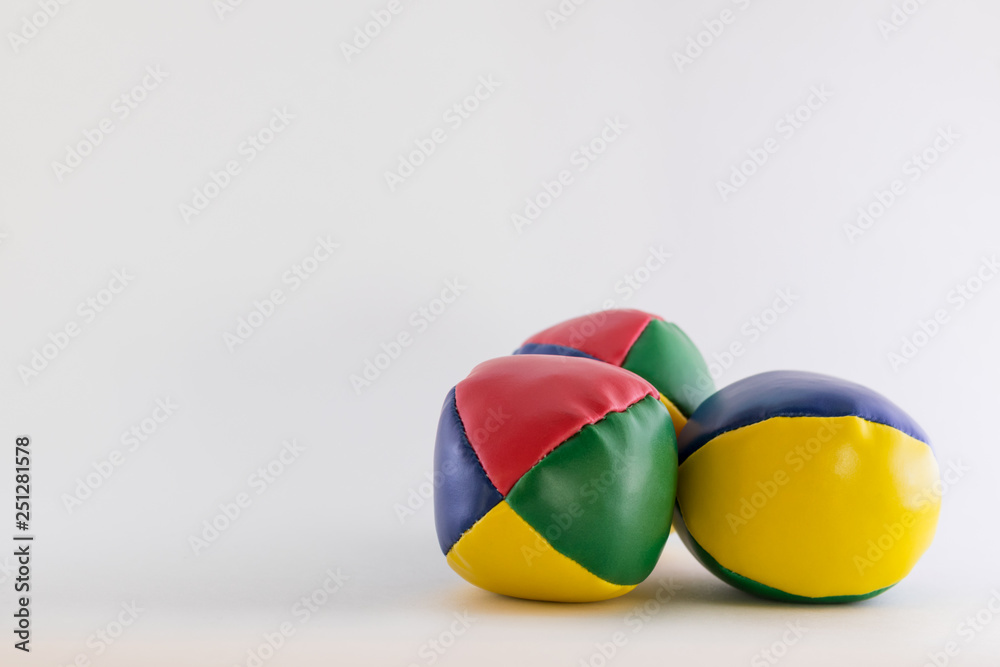 three juggling balls on a blank white background