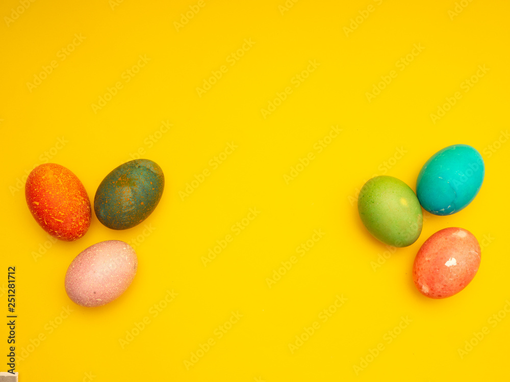 Obraz premium Colorful Easter Eggs On Yellow Background