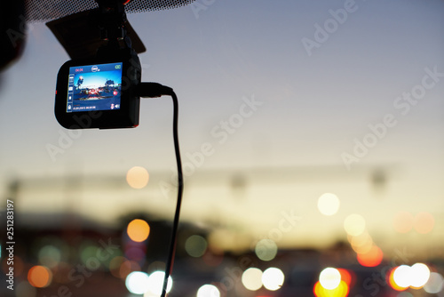 Fotografie Windshield mounted dashcam recording while driving
