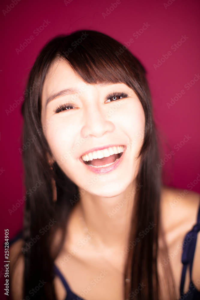closeup Surprised excited woman on red background closeup Surprised excited woman on red background