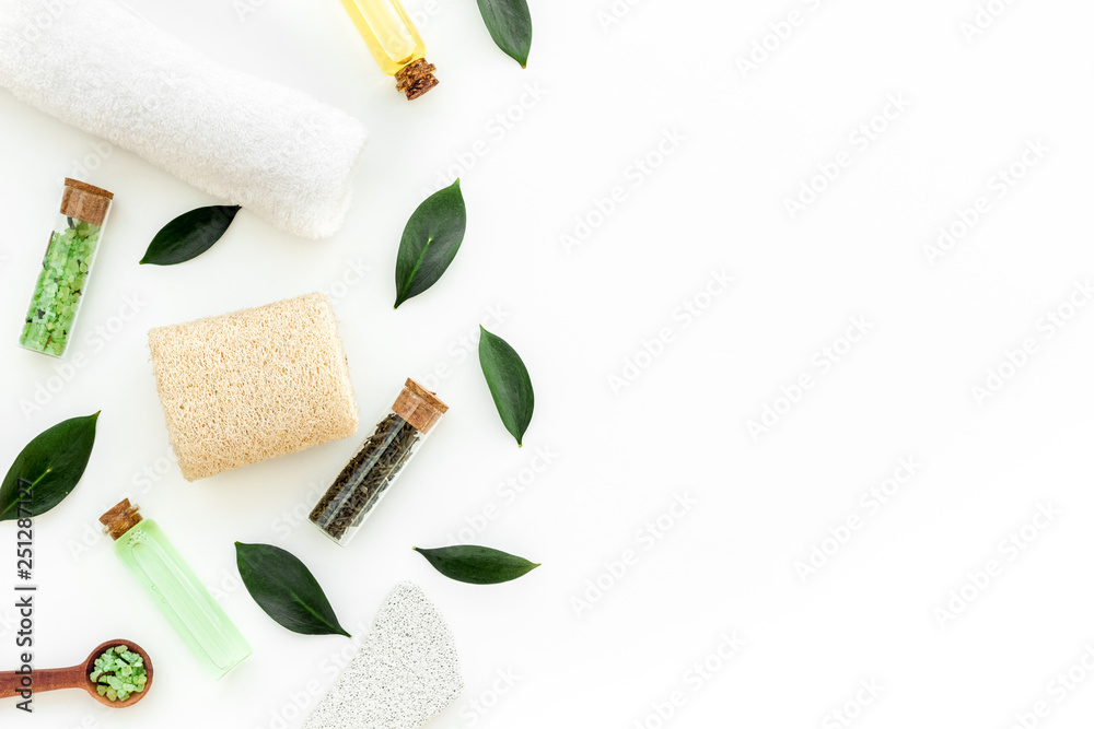 Tea tree spa composition. Fresh tea tree leaves, natural cosmetics, towel on white background top view space for text border