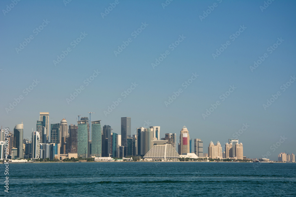 Skyline of the commercial center of Doha with skyscrapers and waterfront