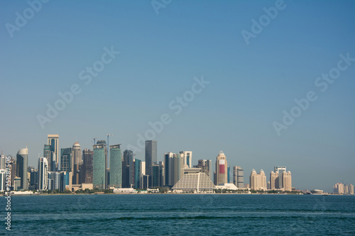 Skyline of the commercial center of Doha with skyscrapers and waterfront