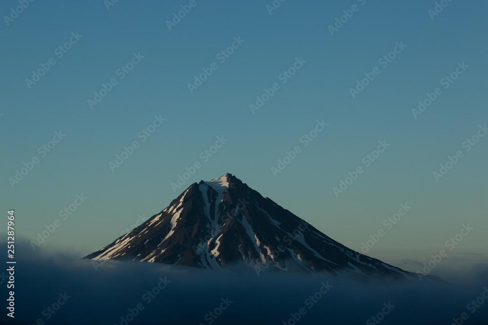 Vilyukinsky volcano at sunset in summer, Russia, Petropavlovsk Vilyukinsky volcano at sunset in summer, Russia, Petropavlovsk