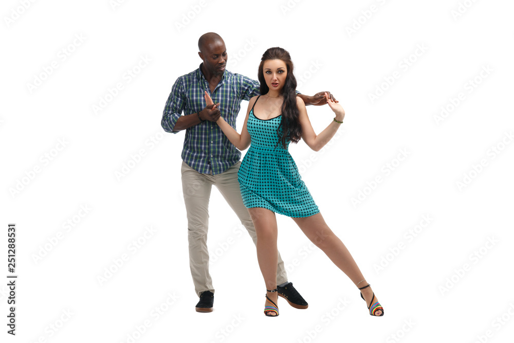 Caucasian girl and black man dancing samba isolated on white background.