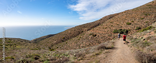 Father and son walking, Chumash and Mugu Peak trail, Point Mugu State Park, Ventura County, California, USA