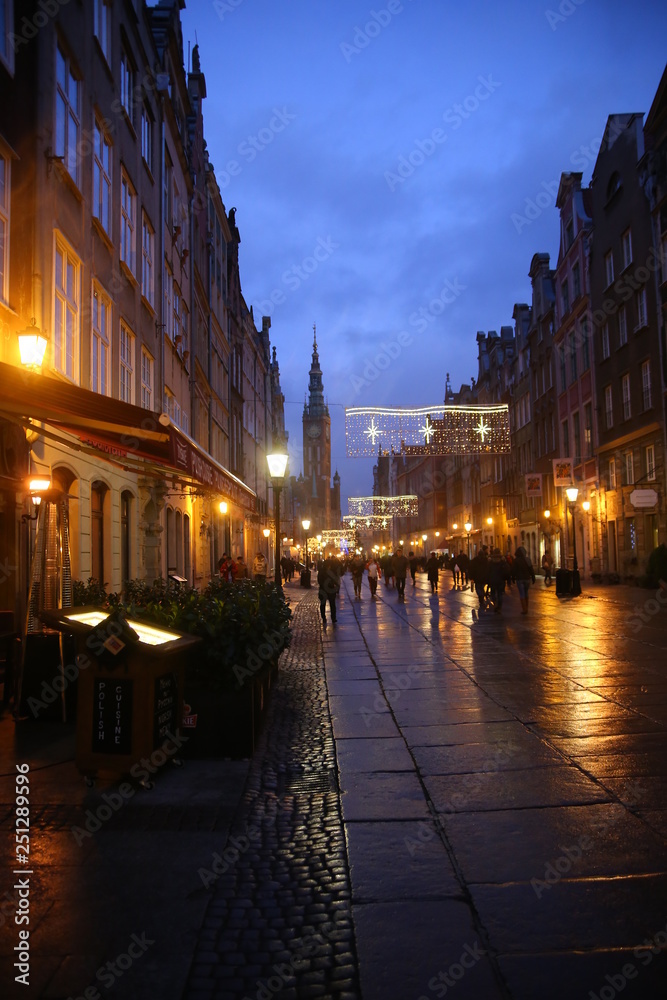 Evening streets of Gdansk in the warm light of lanterns