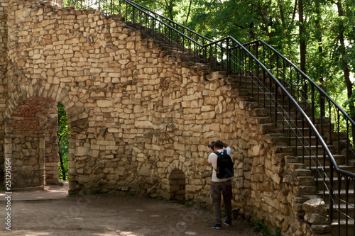 Phographer and ancient yellow wall