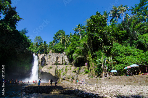 Tegenungan waterfall with blue skies above Kemenuh Village, Sukawati, Gianyar, Bali, Indonesia