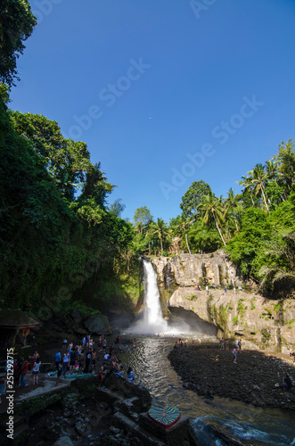 Tegenungan waterfall with blue skies above Kemenuh Village, Sukawati, Gianyar, Bali, Indonesia