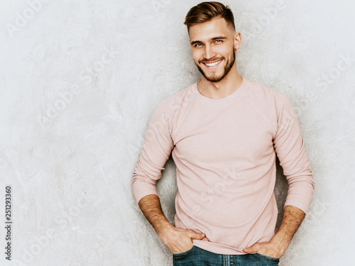 Fotografía Portrait of handsome smiling hipster lumbersexual businessman model wearing casual summer pink clothes