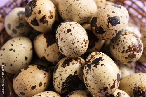 Heap of raw quail eggs, closeup