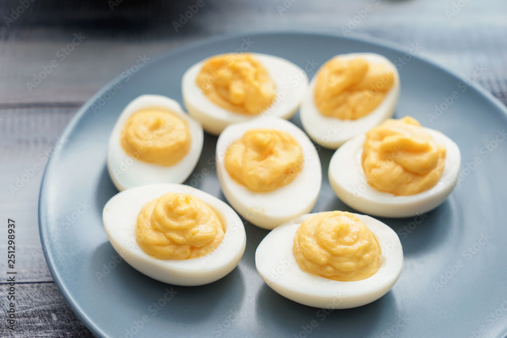 Plate with tasty deviled eggs on table, closeup Plate with tasty deviled eggs on table, closeup
