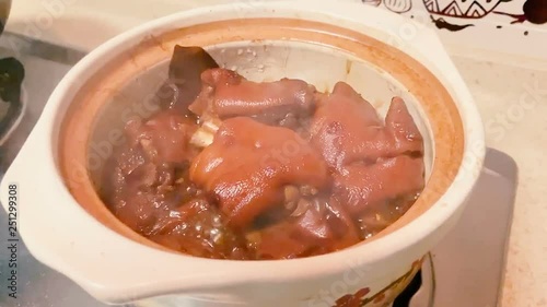 Chinese traditional food - Trotters braised in brown sauce on pot